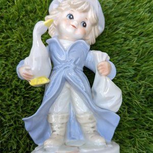 Ceramic boy with duck figure